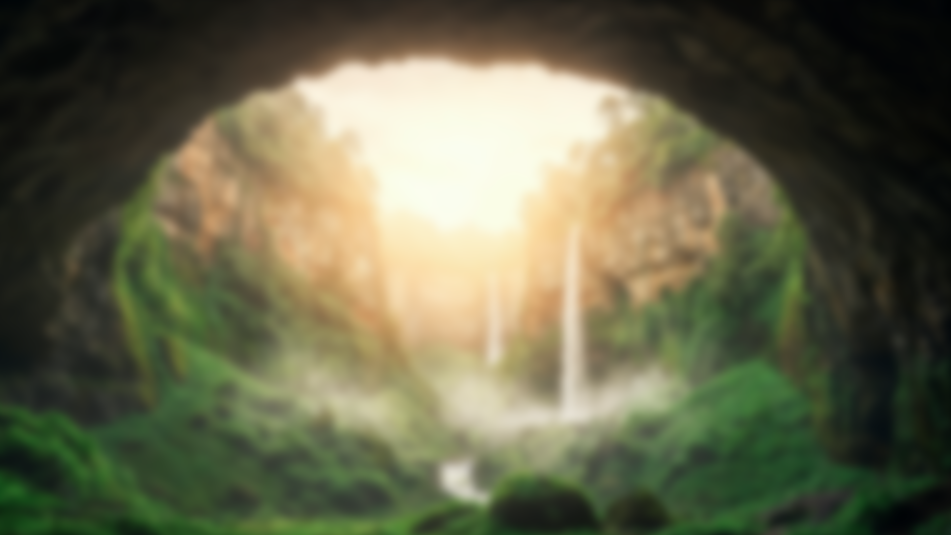 Cave opening overlooking lush valley and waterfalls